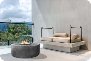Lifestyle Image of the Clindro Concrete Fire Table
